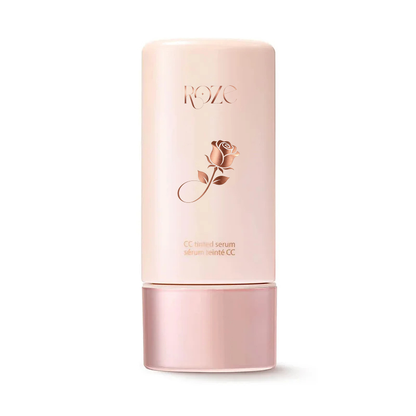 ROZC Rose CC cream serum in a pale pink cylindrical bottle with a matching pink cap, featuring a rose graphic and gold lettering on a white background.